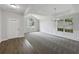 Large living area with a vaulted ceiling, neutral paint, and ample natural light at 2628 Downingwood Ln, Grayson, GA 30017