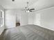 Spacious main bedroom with ceiling fan, neutral walls, and carpet flooring, plus ensuite bath at 2628 Downingwood Ln, Grayson, GA 30017