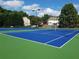 Community tennis courts on a sunny day, surrounded by lush greenery at 2628 Downingwood Ln, Grayson, GA 30017