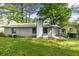Back exterior of the house, which has light-colored siding and dark roof at 5445 Mallard Trl, Lithonia, GA 30058