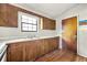 A kitchen featuring wood cabinets and a stainless steel sink at 5445 Mallard Trl, Lithonia, GA 30058