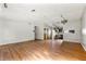 A spacious living room flows into the kitchen, featuring wood floors at 5445 Mallard Trl, Lithonia, GA 30058