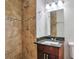 Bathroom showcasing a tiled shower and granite vanity at 5911 Christopher Ln, Lithonia, GA 30058