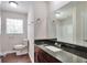 Bathroom features wood floors and granite vanity at 5911 Christopher Ln, Lithonia, GA 30058