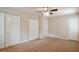 Bedroom featuring neutral carpet and double closets at 5911 Christopher Ln, Lithonia, GA 30058