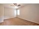 Spacious bedroom features a ceiling fan and neutral carpet at 5911 Christopher Ln, Lithonia, GA 30058