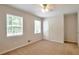Bedroom with carpet, ceiling fan and bright windows at 5911 Christopher Ln, Lithonia, GA 30058