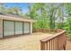 Spacious wooden deck with natural wood finish and railing, perfect for entertaining or relaxing outdoors at 5911 Christopher Ln, Lithonia, GA 30058