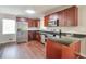 Renovated kitchen showcasing stainless steel appliances, granite counters, and ample cabinet space at 5911 Christopher Ln, Lithonia, GA 30058