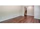 Open living area featuring hardwood floors and access to a staircase at 5911 Christopher Ln, Lithonia, GA 30058