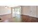 Spacious living room featuring sliding glass doors that lead to a deck, and hardwood floors at 5911 Christopher Ln, Lithonia, GA 30058