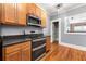 Kitchen area showing oven/stove and wooden cabinetry and stainless microwave at 960 Taft Ne Ave # 9, Atlanta, GA 30309