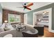 Cozy living room featuring exposed brick wall, ceiling fan, and view to a bedroom at 960 Taft Ne Ave # 9, Atlanta, GA 30309