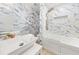 Elegant bathroom showcases marble-style tiling, modern fixtures, and a glass-enclosed shower and bathtub at 1583 Nantahalla Ne Ct, Atlanta, GA 30329