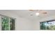 Bright bedroom featuring a ceiling fan, two large windows, and fresh white walls at 1583 Nantahalla Ne Ct, Atlanta, GA 30329