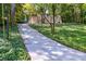 Suburban home with a large yard, driveway, and mature trees at 1583 Nantahalla Ne Ct, Atlanta, GA 30329