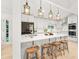 Modern kitchen with a large island, pendant lighting, and stainless steel appliances at 1583 Nantahalla Ne Ct, Atlanta, GA 30329