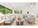 Bright living room with large windows, comfortable seating, and modern decor at 1583 Nantahalla Ne Ct, Atlanta, GA 30329