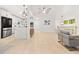Open concept living area with hardwood floors, modern furnishings, and a stylish kitchen at 1583 Nantahalla Ne Ct, Atlanta, GA 30329
