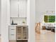Stylish wet bar area with a wine fridge, cabinetry, and countertop space at 1583 Nantahalla Ne Ct, Atlanta, GA 30329