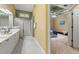 Bright bathroom with double sink vanity, marble floor, and updated shower with glass door at 3219 Abbott Dr # 5, Powder Springs, GA 30127