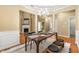Charming dining area boasts modern lighting, and seamless flow to living area and updated kitchen at 3219 Abbott Dr # 5, Powder Springs, GA 30127