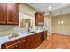 Modern kitchen with updated appliances, wood cabinets, and plenty of counter space, seamlessly connects to dining at 3219 Abbott Dr # 5, Powder Springs, GA 30127