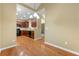 Bright eat-in kitchen featuring hardwood floors, modern appliances, and seamless transition to dining room at 3219 Abbott Dr # 5, Powder Springs, GA 30127