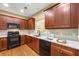 Stylish kitchen with warm wood cabinets, modern appliances, and ample counter space at 3219 Abbott Dr # 5, Powder Springs, GA 30127