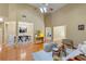 Open-concept living room with hardwood floors, high ceilings, and a seamless transition to dining and kitchen at 3219 Abbott Dr # 5, Powder Springs, GA 30127