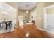 Spacious living room with tall ceilings, hardwood floors, open layout, and seamless transition to dining and bath at 3219 Abbott Dr # 5, Powder Springs, GA 30127