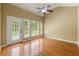 Living room with hardwood floors, plantation shutters, and abundant natural light at 3219 Abbott Dr # 5, Powder Springs, GA 30127