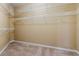 Empty walk-in closet features neutral walls, carpeted floors, and wire shelving at 3219 Abbott Dr # 5, Powder Springs, GA 30127