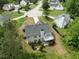 Aerial view of a home with a lush lawn, landscaping, and mature trees at 4219 David Austin Ct, Snellville, GA 30039
