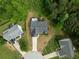 Aerial view of a home with a deck, surrounded by lush greenery in a suburban neighborhood at 4219 David Austin Ct, Snellville, GA 30039