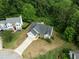 Aerial view of the home with surrounding neighborhood and well-manicured lawns at 4219 David Austin Ct, Snellville, GA 30039