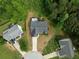 Aerial view of a home showcasing its roof, deck, and surrounding green spaces at 4219 David Austin Ct, Snellville, GA 30039