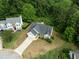 Aerial view of home showcasing landscaped yard, and mature trees at 4219 David Austin Ct, Snellville, GA 30039