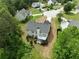 Aerial view of a home with a spacious backyard, deck, and mature trees at 4219 David Austin Ct, Snellville, GA 30039