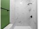Modern bathroom featuring elegant marble-style tiling and sleek black fixtures in the shower at 4219 David Austin Ct, Snellville, GA 30039
