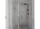 Modern tiled shower with glass door and dual shower heads at 4219 David Austin Ct, Snellville, GA 30039