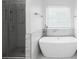 Modern bathroom featuring a soaking tub, updated shower, and large window at 4219 David Austin Ct, Snellville, GA 30039