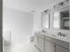 Bright bathroom featuring a double vanity, with marble floors and countertops at 4219 David Austin Ct, Snellville, GA 30039