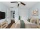 Primary bedroom featuring neutral paint, dark floors, and a ceiling fan at 4219 David Austin Ct, Snellville, GA 30039