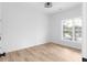 Bright bedroom with hardwood floors and a window with natural light at 4219 David Austin Ct, Snellville, GA 30039