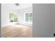 Bedroom with hardwood floors, neutral paint, and natural light from a set of windows at 4219 David Austin Ct, Snellville, GA 30039