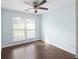 Bright bedroom with ample natural light, ceiling fan, and hardwood flooring at 4219 David Austin Ct, Snellville, GA 30039