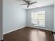 This bedroom features a ceiling fan, wood floors, and a window to let in plenty of natural light at 4219 David Austin Ct, Snellville, GA 30039