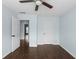 Spacious bedroom featuring stylish wood flooring, ceiling fan, and modern decor at 4219 David Austin Ct, Snellville, GA 30039