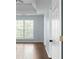 An open doorway reveals a bedroom with hardwood floors and bright lighting at 4219 David Austin Ct, Snellville, GA 30039
